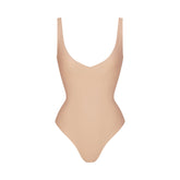 SKIMS BODY UNLINED PLUNGE THONG BODYSUIT | CLAY