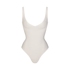 SKIMS BODY UNLINED PLUNGE THONG BODYSUIT | IVORY