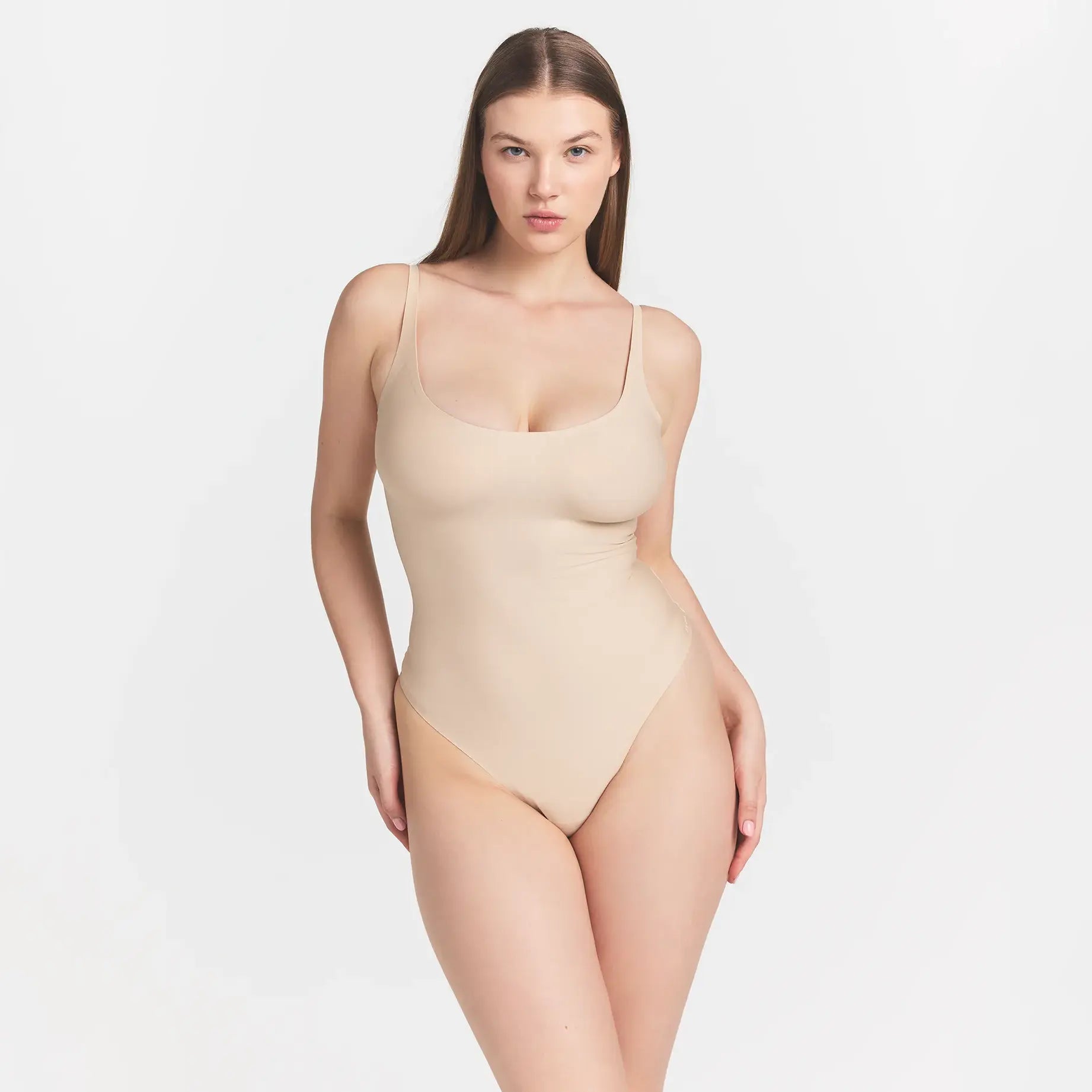 SKIMS BODY SCOOP LOW BACK THONG BODYSUIT | SAND