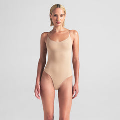 SHEER SEAMLESS THONG BODYSUIT | SAND