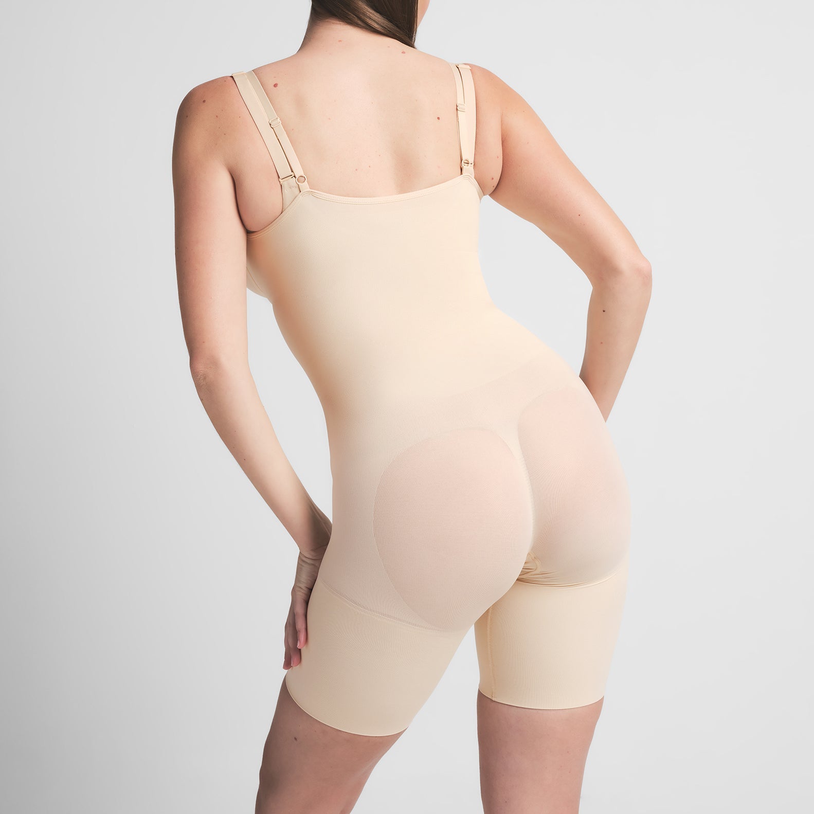 SEAMLESS SCULPT BUTT LIFTING OPEN BUST BODYSUIT | SAND